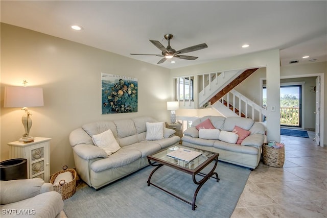 living area featuring recessed lighting, visible vents, stairway, and light tile patterned floors