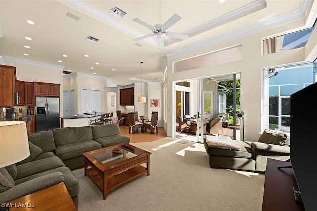 living room with ceiling fan, visible vents, crown molding, and recessed lighting