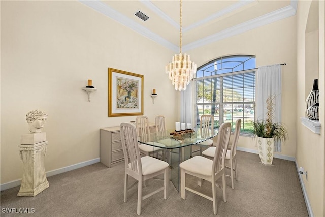 dining room with carpet floors, crown molding, a notable chandelier, visible vents, and baseboards