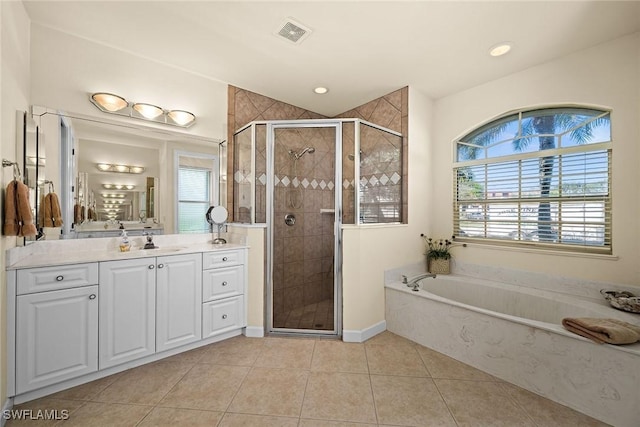 full bath featuring a stall shower, visible vents, a wealth of natural light, and vanity