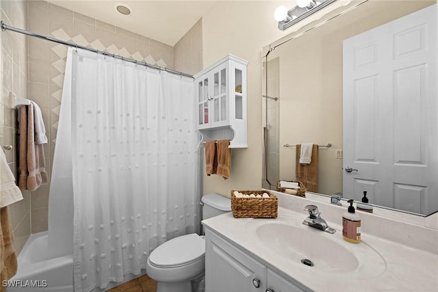 bathroom with shower / bath combo with shower curtain, vanity, and toilet