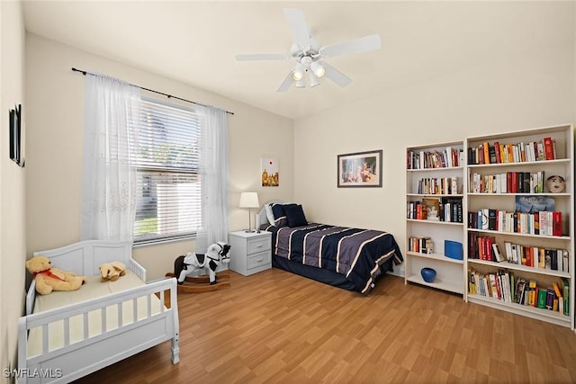 bedroom featuring ceiling fan and wood finished floors