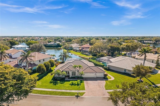 bird's eye view featuring a water view and a residential view