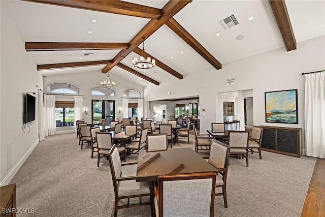 dining room featuring an inviting chandelier, visible vents, high vaulted ceiling, and beam ceiling