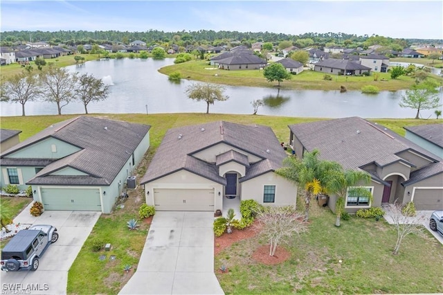 aerial view featuring a residential view and a water view