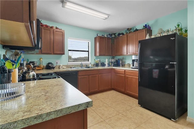 kitchen with brown cabinets, light tile patterned floors, light countertops, a sink, and black appliances