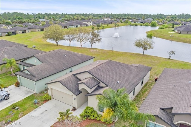 bird's eye view with a water view and a residential view