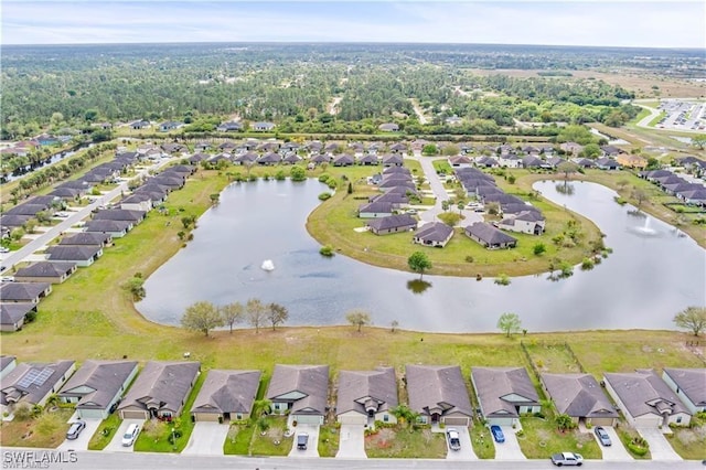 birds eye view of property featuring a water view and a residential view