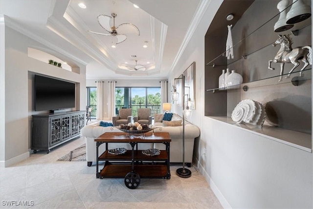 living area with crown molding, recessed lighting, a raised ceiling, a ceiling fan, and baseboards