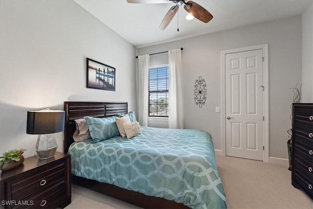 bedroom featuring carpet floors, a ceiling fan, and baseboards