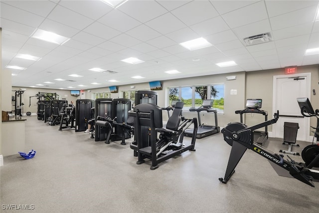 exercise room featuring a paneled ceiling and visible vents