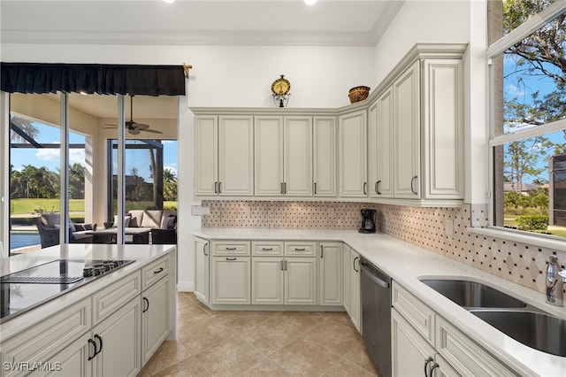 kitchen with a sink, backsplash, crown molding, light countertops, and dishwasher