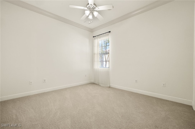 empty room with ceiling fan, baseboards, light carpet, and ornamental molding