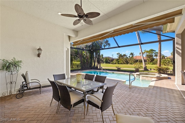 view of swimming pool featuring a ceiling fan, a pool with connected hot tub, a patio, outdoor dining area, and a lanai