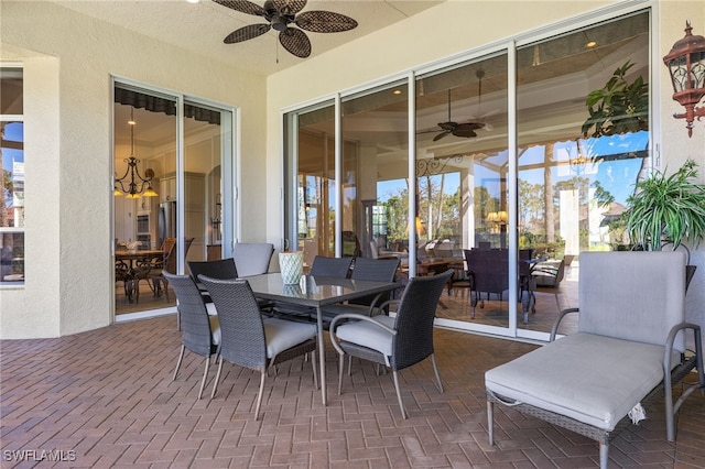 view of patio / terrace featuring outdoor dining area and a ceiling fan