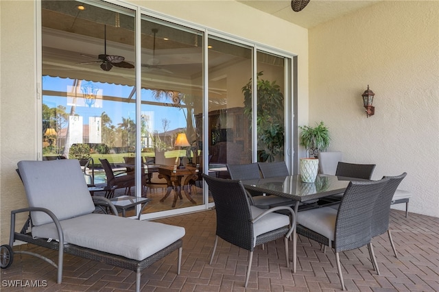 view of patio / terrace with outdoor dining area and ceiling fan