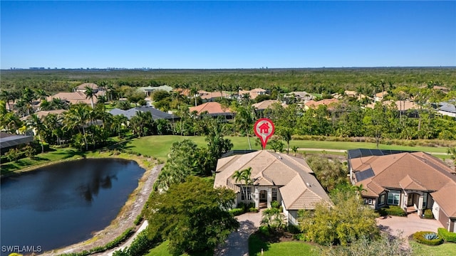 birds eye view of property featuring a water view