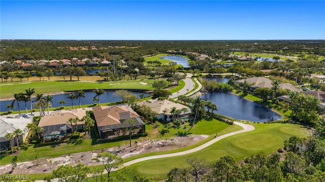 aerial view featuring a residential view, golf course view, and a water view