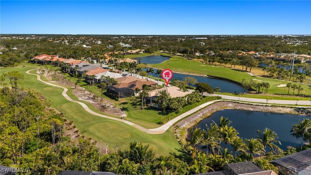 birds eye view of property with a water view and golf course view