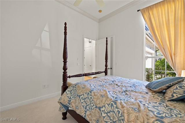 carpeted bedroom with ceiling fan, baseboards, and ornamental molding