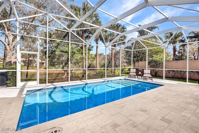 view of swimming pool featuring a fenced in pool, glass enclosure, a patio, and fence