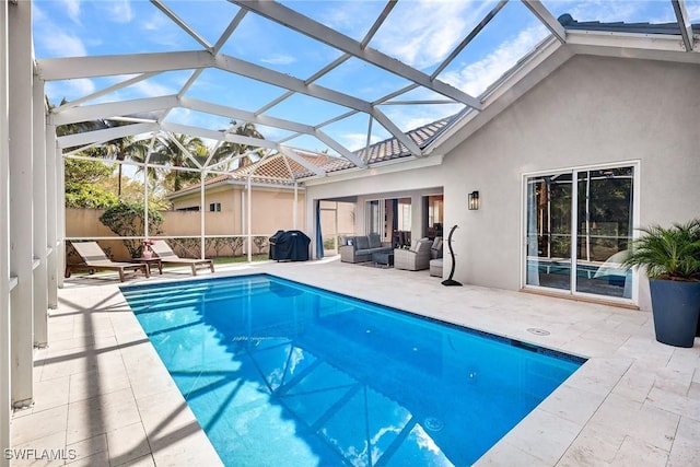 outdoor pool featuring grilling area, fence, outdoor lounge area, and a patio