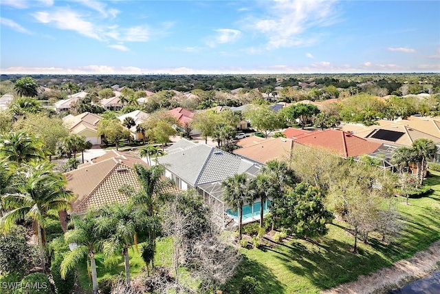 birds eye view of property with a residential view