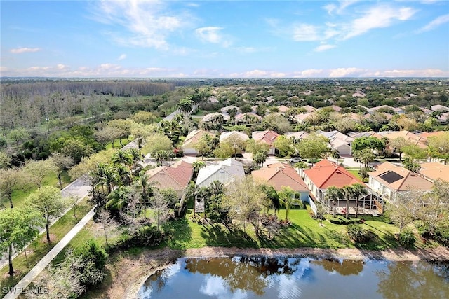 bird's eye view featuring a water view and a residential view