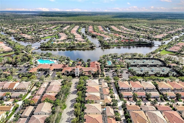 drone / aerial view featuring a residential view and a water view