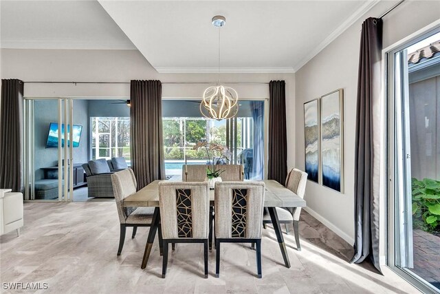 dining room featuring an inviting chandelier, baseboards, and ornamental molding