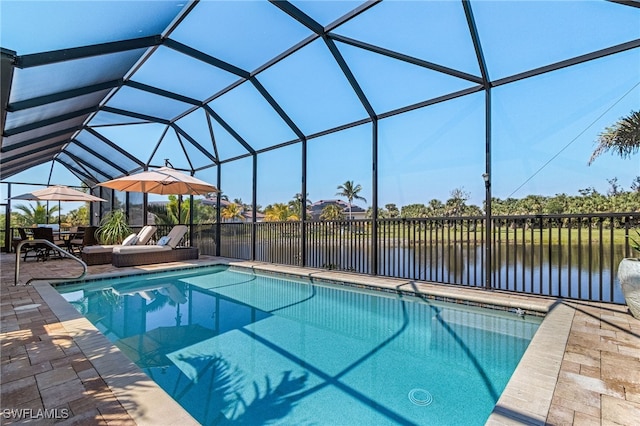 view of swimming pool with a fenced in pool, glass enclosure, a patio, and a water view