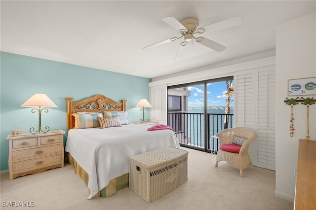 carpeted bedroom with access to exterior and a ceiling fan