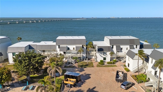 birds eye view of property featuring a residential view and a water view