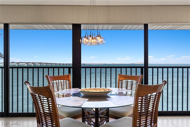 wooden terrace featuring a water view