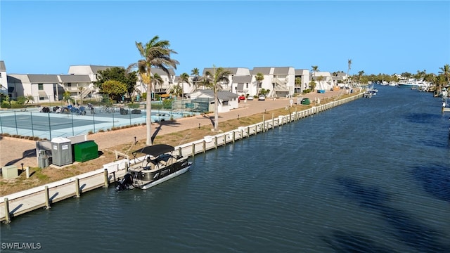 birds eye view of property with a residential view and a water view