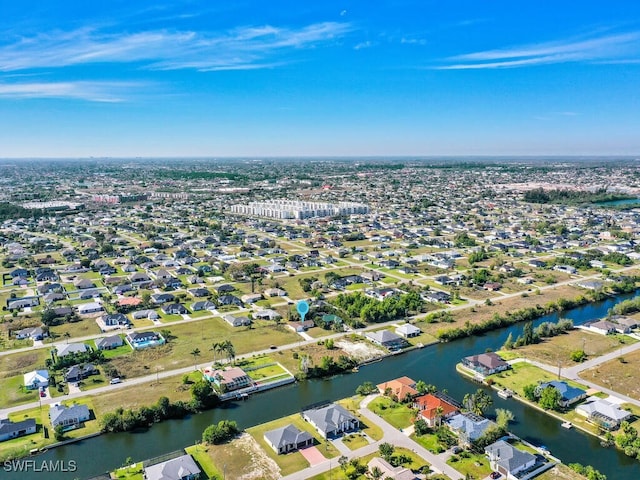 aerial view featuring a residential view and a water view