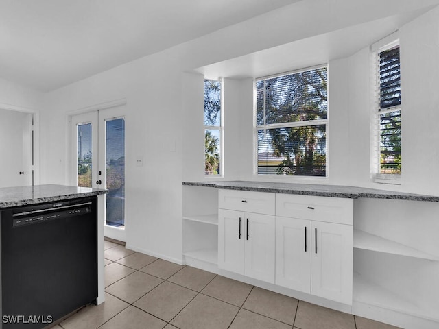 kitchen featuring light stone countertops, dishwasher, light tile patterned floors, white cabinets, and open shelves