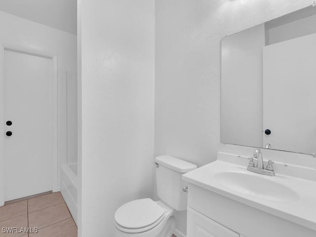 full bathroom featuring vanity, tile patterned floors, and toilet