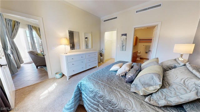 bedroom with a spacious closet, visible vents, ornamental molding, and light colored carpet