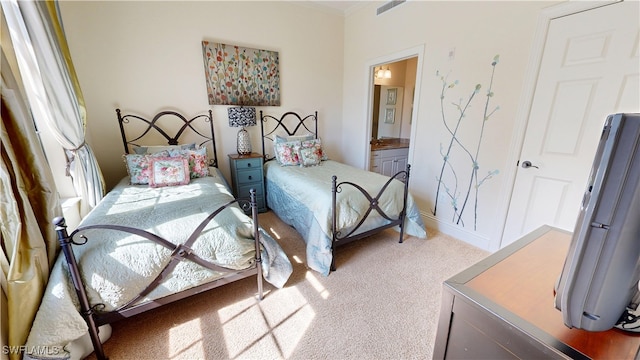 bedroom featuring light colored carpet, connected bathroom, and visible vents