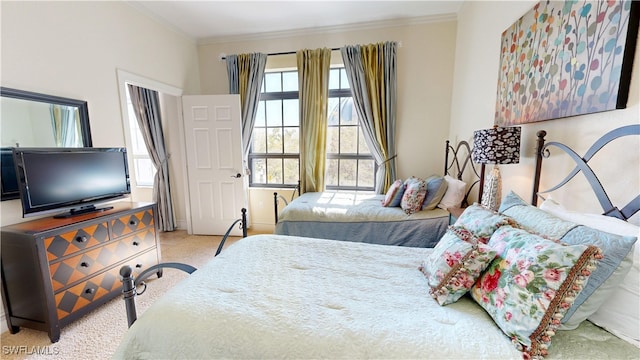 carpeted bedroom featuring ornamental molding