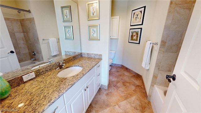 full bathroom featuring toilet, washtub / shower combination, baseboards, and vanity