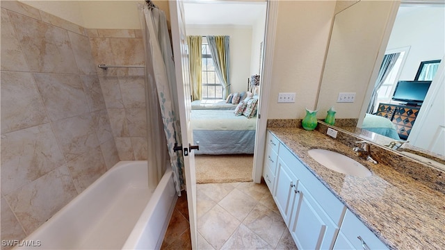 ensuite bathroom featuring shower / tub combo with curtain, ornamental molding, vanity, ensuite bath, and tile patterned floors