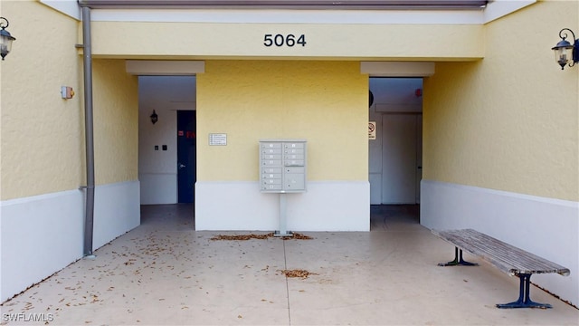 entrance to property with stucco siding