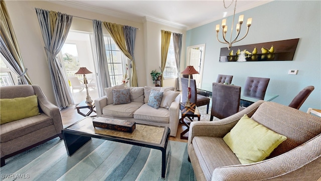 living area with a notable chandelier, crown molding, and wood finished floors