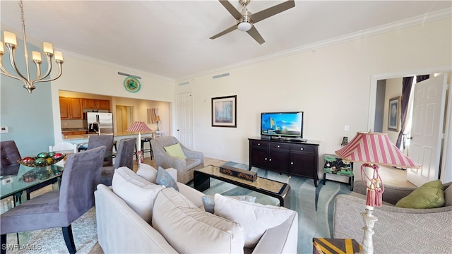 living room with visible vents, crown molding, and ceiling fan with notable chandelier