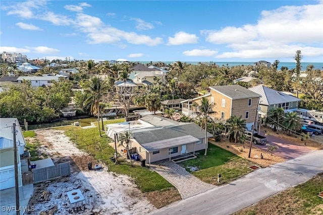 aerial view with a water view and a residential view