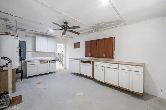 kitchen with a ceiling fan, light countertops, and unfinished concrete floors