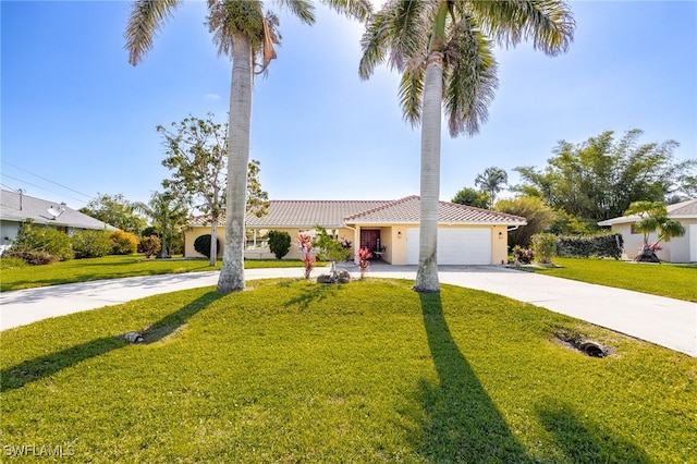 view of front of house featuring an attached garage, concrete driveway, a tiled roof, stucco siding, and a front lawn