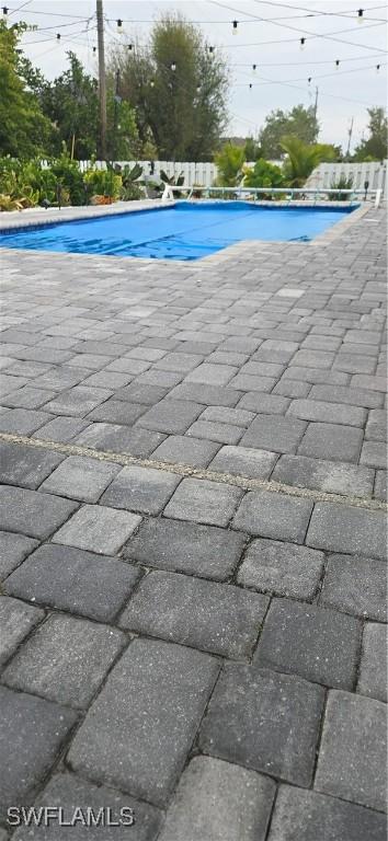 pool featuring a patio area